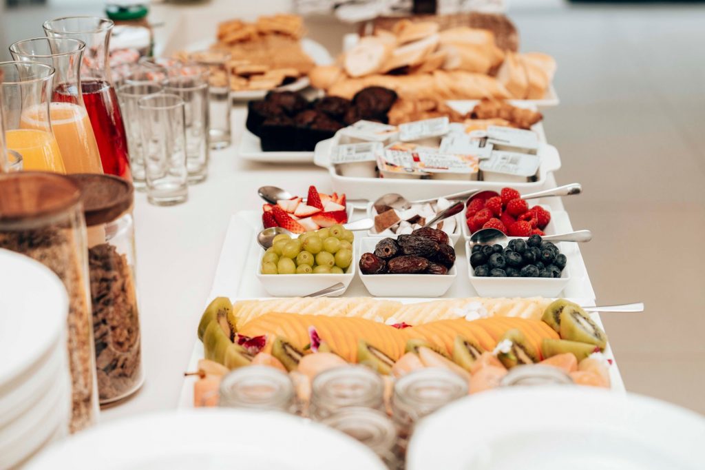 Colorful breakfast buffet featuring fresh fruits, pastries, and juices. Ideal for healthy and delicious morning meals.