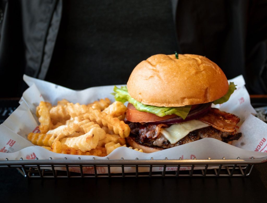 Delicious cheeseburger served with crinkle-cut fries in a classic presentation.