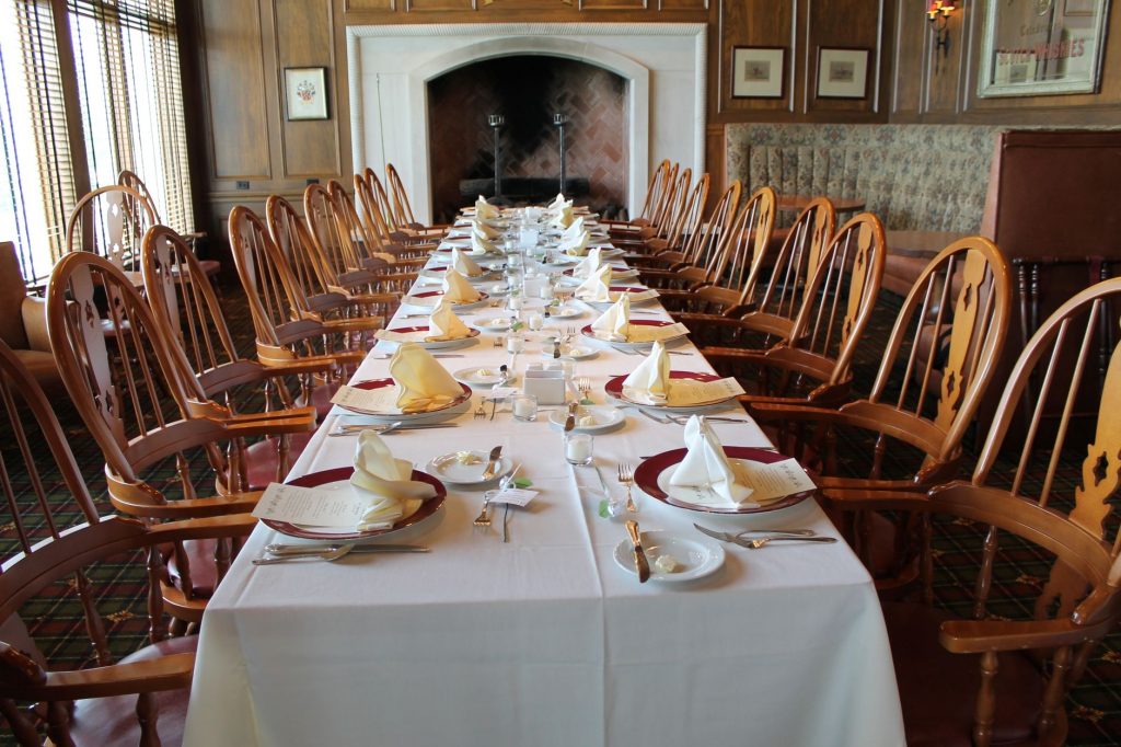 Formal dining table set in a classic rustic room, perfect for special gatherings.