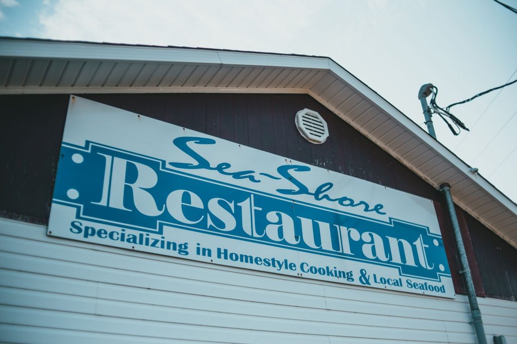 Sea Shore Restaurant sign showcasing homestyle cooking and local seafood.