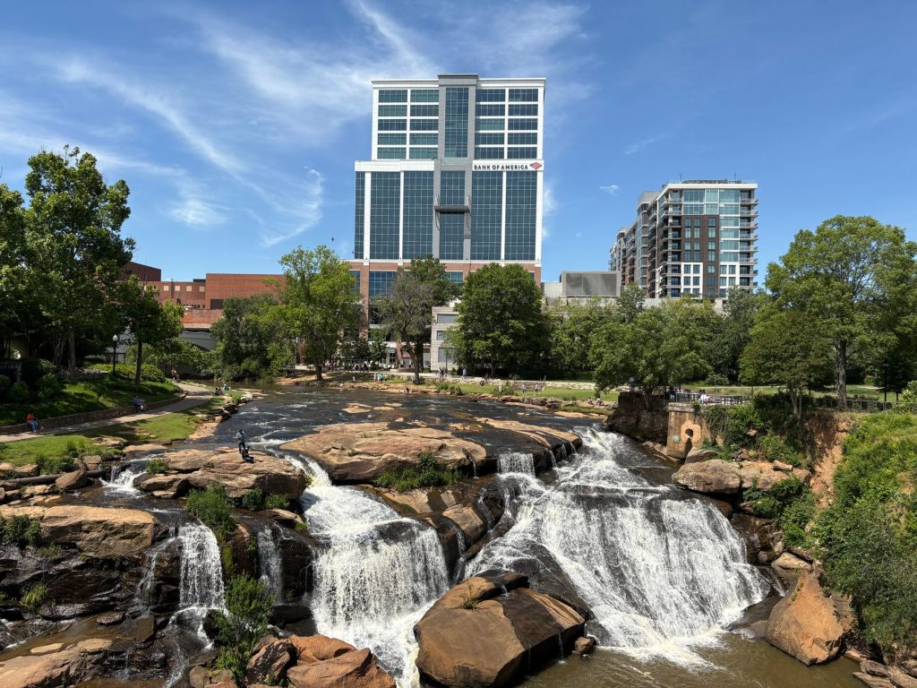 View of downtown Greenville with Reedy River Falls, a unique blend of nature and urban landscape.